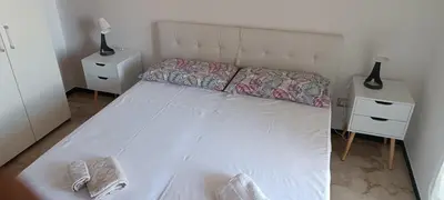 Letto o letti in una camera di Casa Erina