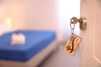 Letto o letti in una camera di Verdemare relax & rooms