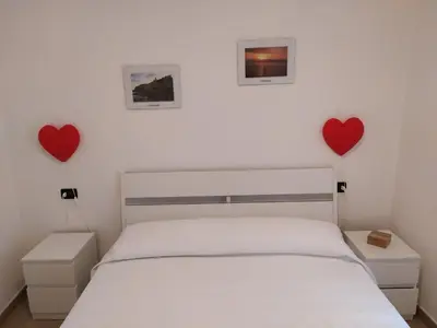Letto o letti in una camera di Casetta Rosa