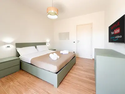 Letto o letti in una camera di Modena Skyline - View on Ghirlandina