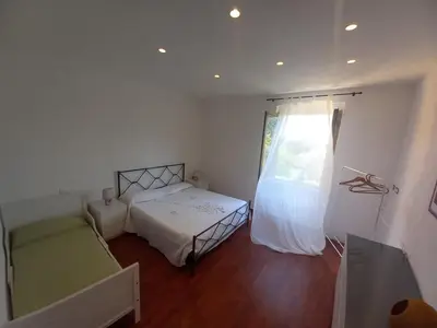 Letto o letti in una camera di Anna's Little House, Cinque Terre, Lerici