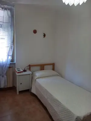 Letto o letti in una camera di Anna's Little House, Cinque Terre, Lerici