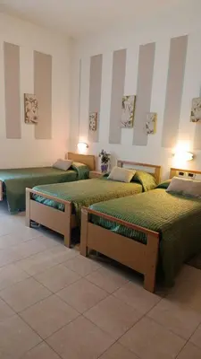 Letto o letti in una camera di Hotel Azzurra