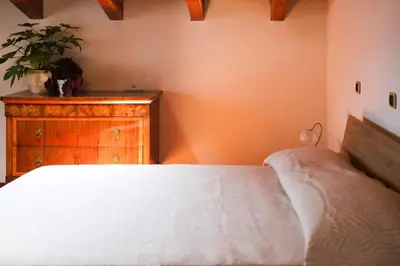 Letto o letti in una camera di Villa Paola - mansarda Glam -