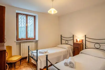 Letto o letti in una camera di Casa con giardino da Toni