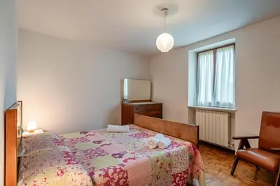 Letto o letti in una camera di Casa con giardino da Toni