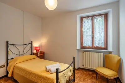 Letto o letti in una camera di Casa con giardino da Toni