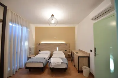Letto o letti in una camera di Hotel Vignale