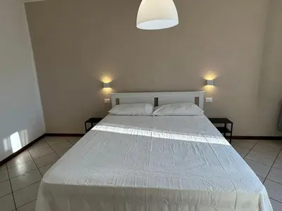 Letto o letti in una camera di Casa del Pescatore