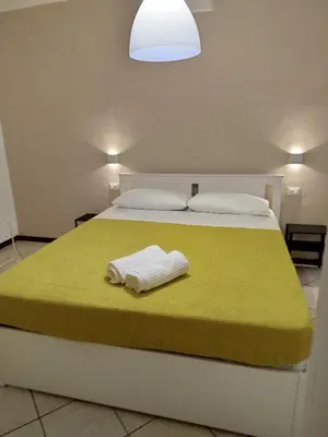 Letto o letti in una camera di Casa del Pescatore
