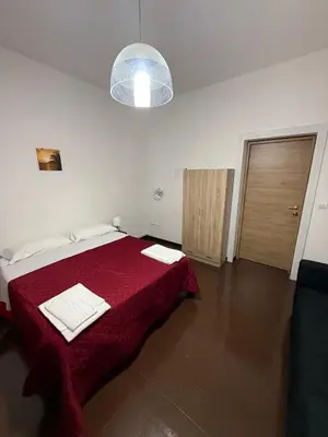 Letto o letti in una camera di Sc Residence Parma