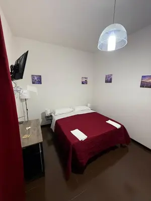 Letto o letti in una camera di Sc Residence Parma