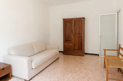 Area soggiorno di Xenia - 2rooms apt in Salita Sant'Agostino 15