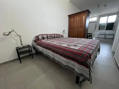 Letto o letti in una camera di Mini loft Orchidea-Stazione La Spezia Migliarina