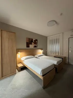 Letto o letti in una camera di Dormi-RE 2