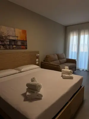 Letto o letti in una camera di Dormi-RE 2