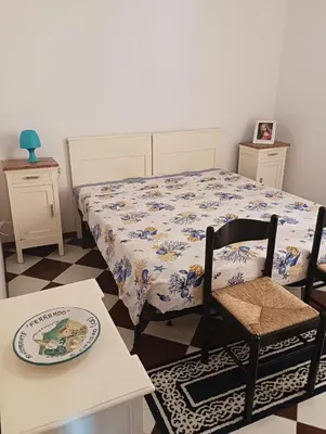 Letto o letti in una camera di Casa Miki front Chiosco della Musica and Beach