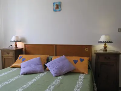 Letto o letti in una camera di Casa Bruna Appartamenti