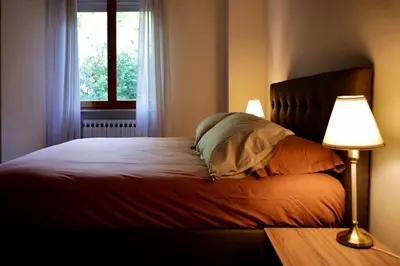 Letto o letti in una camera di B&B Villa Sassuolo by EUROMODENA