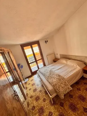 Letto o letti in una camera di Casa Stella