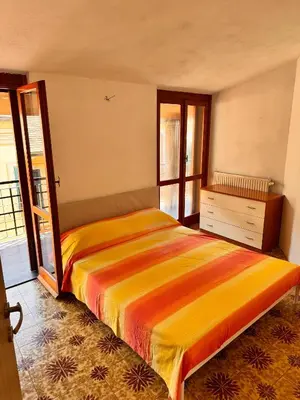 Letto o letti in una camera di Casa Stella