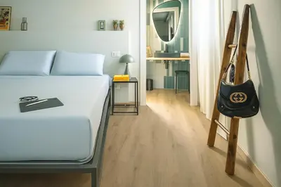 Letto o letti in una camera di La Croce Apartments