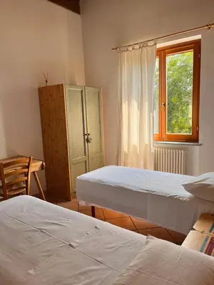 Letto o letti in una camera di Il Cortile Agriturismo