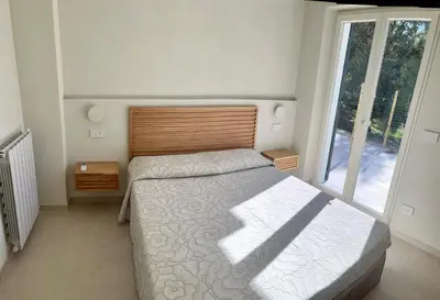 Letto o letti in una camera di Il Nido Verde, Giardinetta e Mansardina