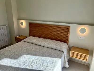 Letto o letti in una camera di Il Nido Verde, Giardinetta e Mansardina