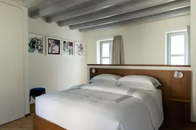 Letto o letti in una camera di Dé Corner Rooms and Suites