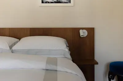 Letto o letti in una camera di Dé Corner Rooms and Suites