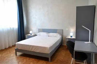 Letto o letti in una camera di Palazzo Cavalieri Business&Relax 12Tristano