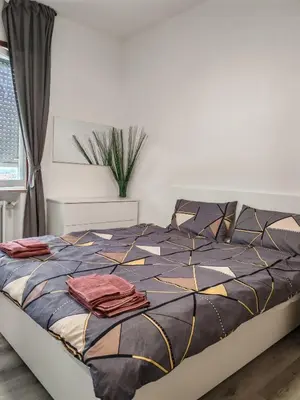 Letto o letti in una camera di Casa ALFRED FIDENZA