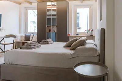 Letto o letti in una camera di Monolocale San Pietro centro storico di Reggio Emilia