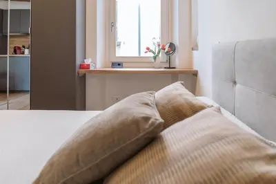 Letto o letti in una camera di Monolocale San Pietro centro storico di Reggio Emilia