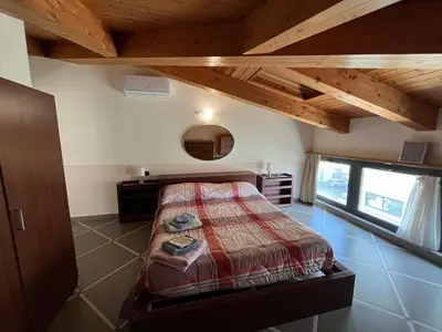 Letto o letti in una camera di Appartamento via Giorgio Canale 72