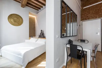 Letto o letti in una camera di Zen Loft - Suite con Jacuzzi nel cuore di Modena