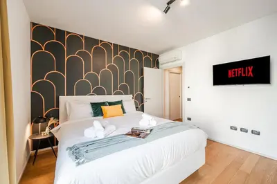 Letto o letti in una camera di Station - Elegante appartamento con Garage