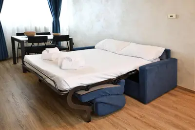 Letto o letti in una camera di Palazzo Cavalieri business&relax 10Galvano