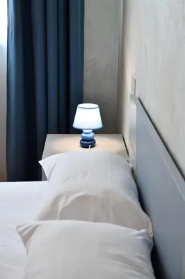 Letto o letti in una camera di Palazzo Cavalieri business&relax 5aBors