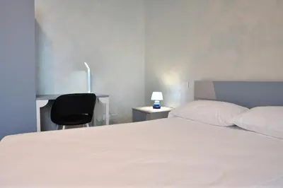 Letto o letti in una camera di Palazzo Cavalieri Business&Relax 5Perceval