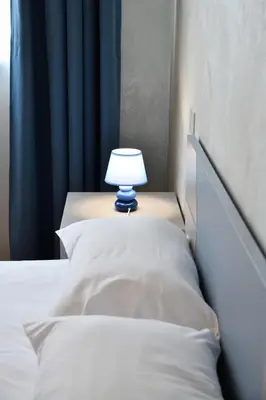 Letto o letti in una camera di Palazzo Cavalieri Business&Relax 5Perceval