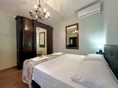 Letto o letti in una camera di JOY Triolcale in centro con terrazza