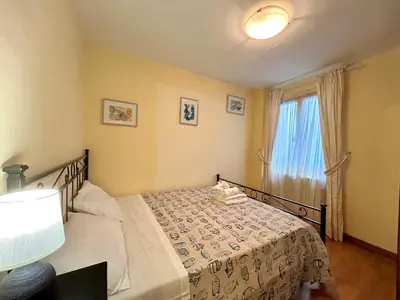Letto o letti in una camera di JOY Triolcale in centro con terrazza