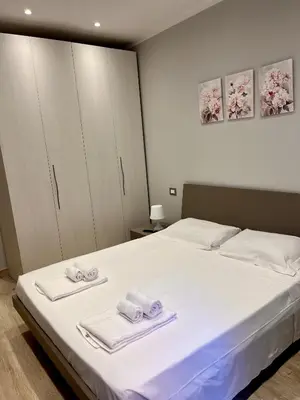 Letto o letti in una camera di Bilocale 'I Portici'