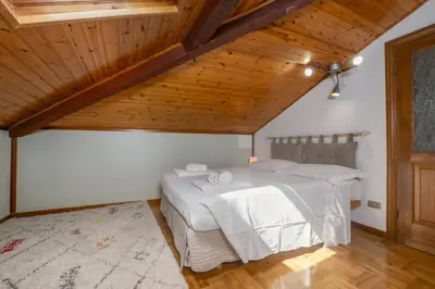 Letto o letti in una camera di La Mansarda del Borgo