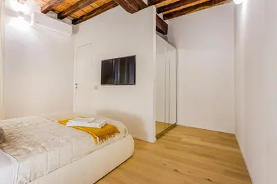 Letto o letti in una camera di Nebbia sul Naviglio - Rua Frati 34 Palace by MoVeBNB