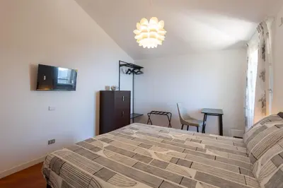 Letto o letti in una camera di Cava Ardè Rooms