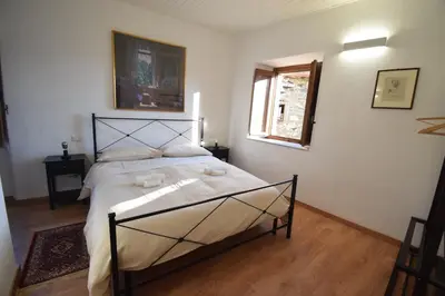 Letto o letti in una camera di La Casa del Cucchin
