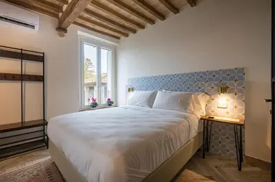 Letto o letti in una camera di GuestHost - Bixio 29 Apartments 4 and 6